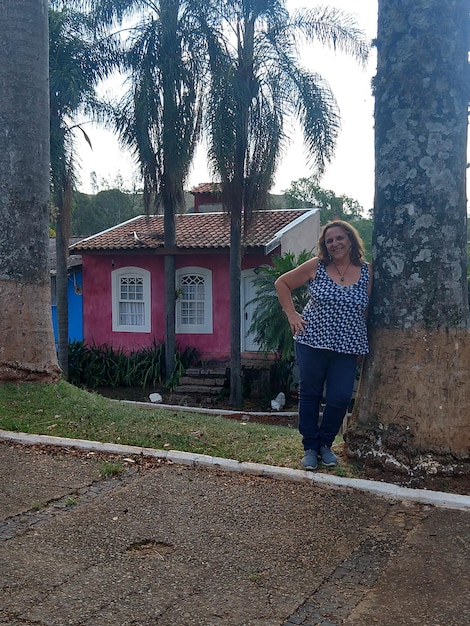 An image of a newly constructed or renovated house in a rural area of Colombia, built specifically for elderly residents with accessibility features. The house should appear comfortable and safe.
