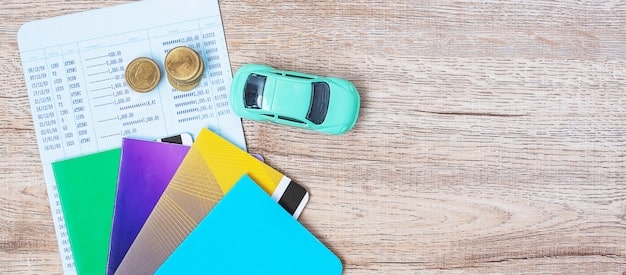 A close-up of a credit score report showing a high score. Beside it, there's a miniature car and a pen resting on the document.
