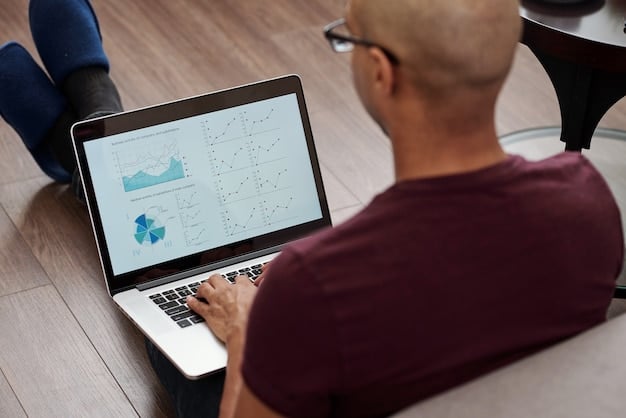 A close-up of a Colombian man's hands using a laptop, with charts and graphs about credit scores visible on the screen. He is focused and intent on analyzing the data.